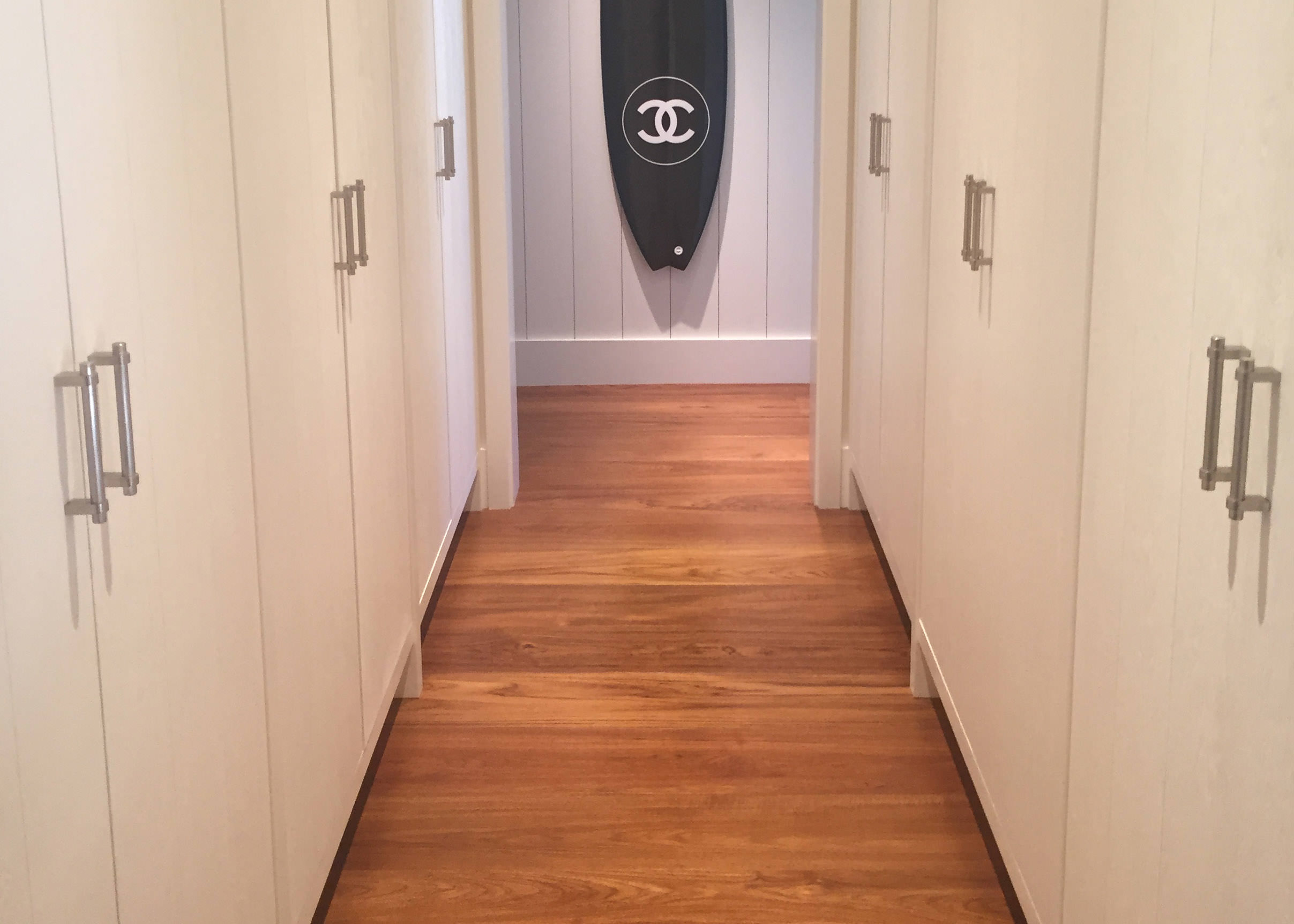 Custom Handscraped Teak Hardwood flooring in hallway in Wailea Maui